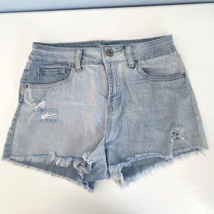 Mismatched pattern faded blue ripped jean shorts